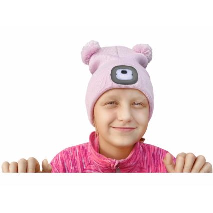 Extol - Kapa sa čelovkom i USB punjenjem 250 mAh, roze sa pomponima, vel. dečija