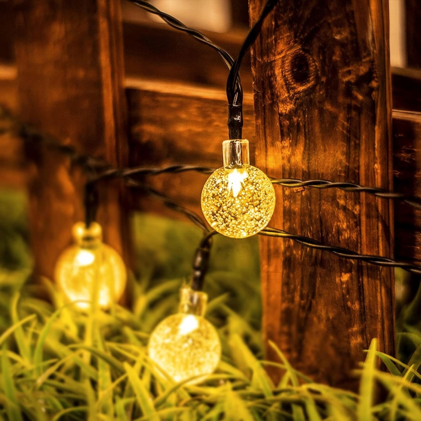 LED solarni dekorativni lanac 30xLED/8 funkcija 500 mAh 6,5 m IP67 topla bela