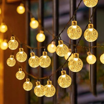 LED solarni dekorativni lanac 50xLED/8 funkcija 500 mAh 9,5 m IP67 topla bela