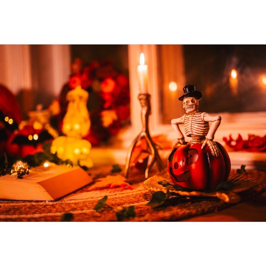 LED Dekoracija HALLOWEEN LED/2xLR44/topla bela kostur u bundevi smola